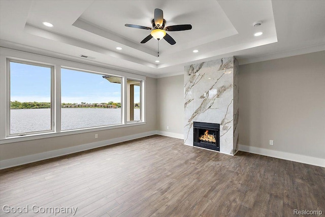 1760 Hamilton Dr, Bloomfield Hills, MI 48302 - unfurnished living room with a raised ceiling, wood finished floors, a fireplace, a ceiling fan, and recessed lighting