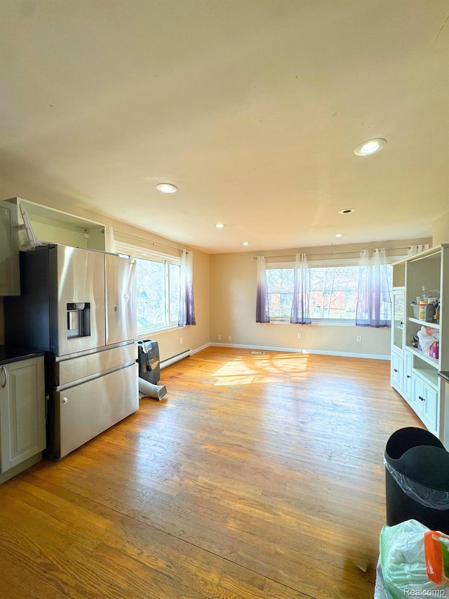 14070 Nadine St, Oak Park, MI 48237 - living area with light wood-style floors, a baseboard heating unit, recessed lighting, and baseboards