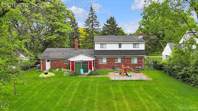 2408 Otter St, Warren, MI 48092 - back of house with brick siding, a chimney, an outdoor structure, and central AC