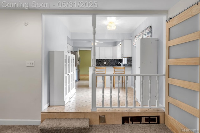 2408 Otter St, Warren, MI 48092 - kitchen featuring white cabinets, backsplash, ceiling fan, freestanding refrigerator, and light tile patterned floors