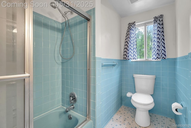 2408 Otter St, Warren, MI 48092 - bathroom with toilet, washtub / shower combination, tile patterned floors, tile walls, and wainscoting