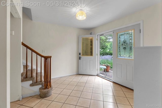 2408 Otter St, Warren, MI 48092 - entryway featuring stairs, light tile patterned floors, and baseboards