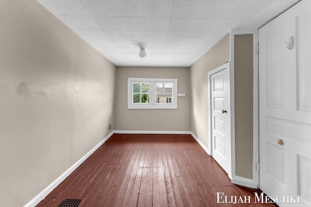 621 Olympia St SW, Grand Rapids, MI 49503 - empty room with hardwood / wood-style flooring and baseboards