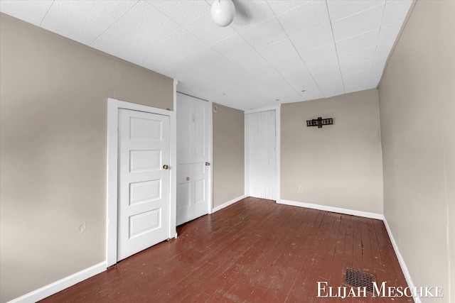 621 Olympia St SW, Grand Rapids, MI 49503 - unfurnished room featuring wood-type flooring and baseboards