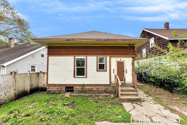 621 Olympia St SW, Grand Rapids, MI 49503 - back of house with entry steps and roof with shingles