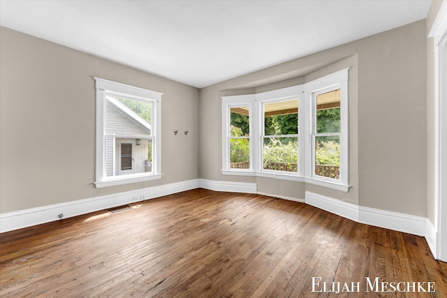 621 Olympia St SW, Grand Rapids, MI 49503 - unfurnished room featuring wood-type flooring and baseboards