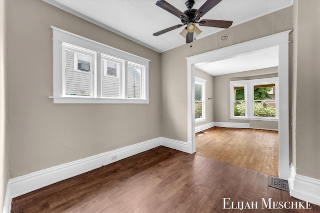 621 Olympia St SW, Grand Rapids, MI 49503 - empty room featuring wood finished floors, baseboards, and ceiling fan