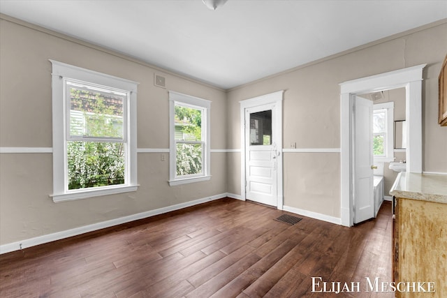621 Olympia St SW, Grand Rapids, MI 49503 - unfurnished room with dark wood-style floors and baseboards