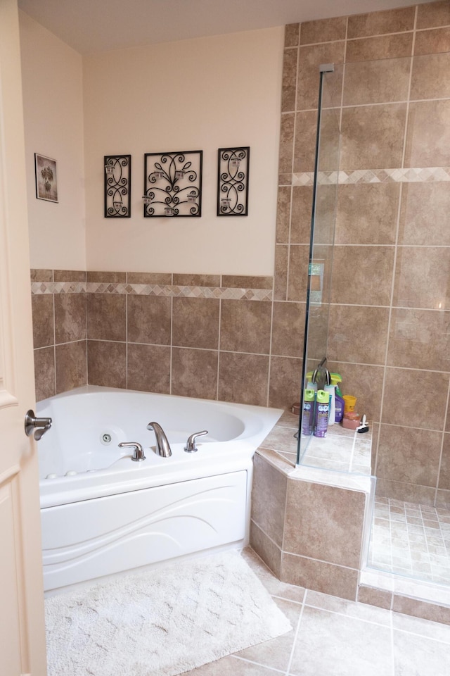 18774 Old Field Rd, New Buffalo, MI 49117 - full bathroom featuring a jetted tub, tile patterned flooring, and tiled shower