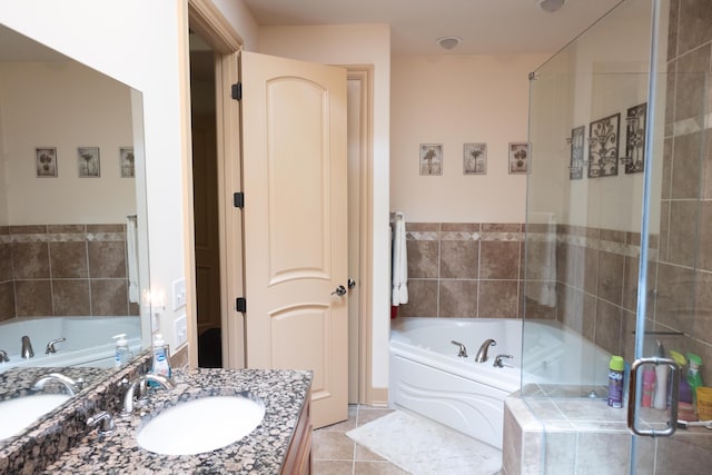 18774 Old Field Rd, New Buffalo, MI 49117 - full bathroom featuring vanity, a garden tub, tile patterned floors, and a shower stall