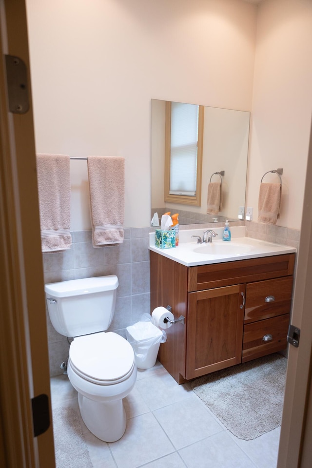 18774 Old Field Rd, New Buffalo, MI 49117 - half bath with toilet, vanity, tile patterned floors, a wainscoted wall, and tile walls