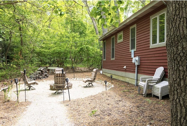 18774 Old Field Rd, New Buffalo, MI 49117 - view of yard featuring a forest view and a fire pit
