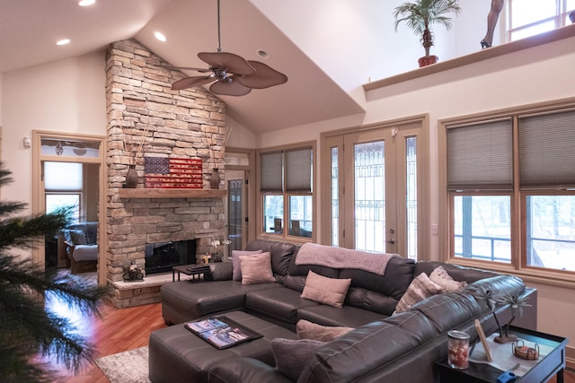 18774 Old Field Rd, New Buffalo, MI 49117 - living room with high vaulted ceiling, wood finished floors, a stone fireplace, a ceiling fan, and recessed lighting