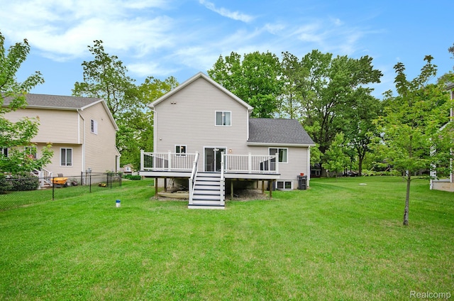 4686 Downing Dr, Pinckney, MI 48169 - back of property with a wooden deck and stairs