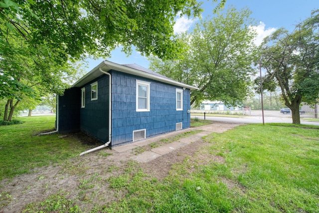130 N Horton St, Jackson, MI 49202 - view of home's exterior with a lawn
