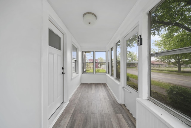 130 N Horton St, Jackson, MI 49202 - unfurnished sunroom with wood finished floors
