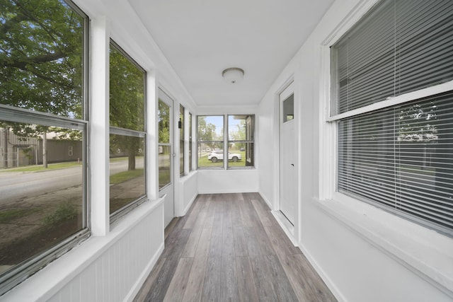 130 N Horton St, Jackson, MI 49202 - unfurnished sunroom with wood finished floors and baseboards