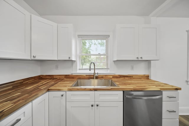 130 N Horton St, Jackson, MI 49202 - kitchen with wood counters, stainless steel dishwasher, a sink, and white cabinets