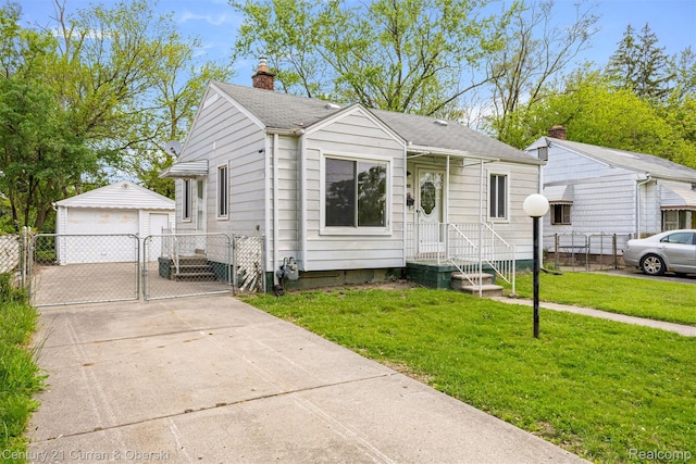 25960 Yale St, Inkster, MI 48141 - bungalow featuring a gate, a chimney, a detached garage, an outdoor structure, and a shingled roof