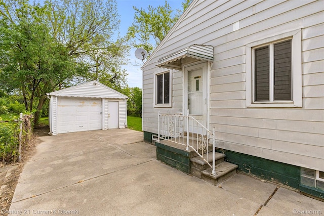 25960 Yale St, Inkster, MI 48141 - view of side of property with a garage, an outbuilding, and entry steps