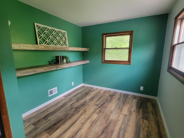 1328 S Montgomery St, Hastings, MI 49058 - unfurnished room featuring dark wood-style floors and baseboards