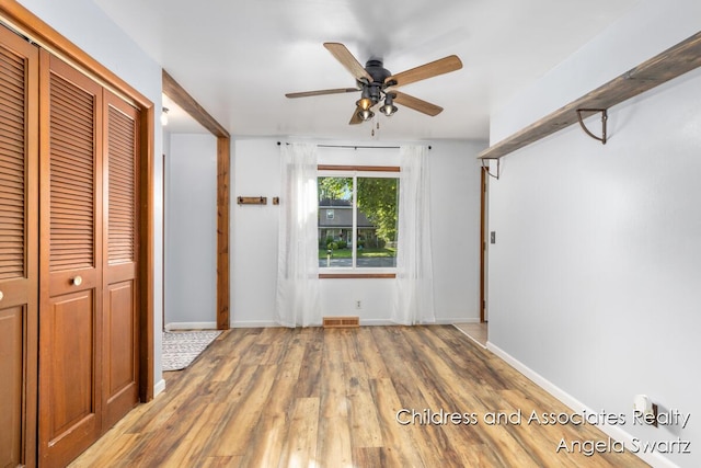 1328 S Montgomery St, Hastings, MI 49058 - unfurnished bedroom featuring a closet, wood finished floors, baseboards, and a ceiling fan