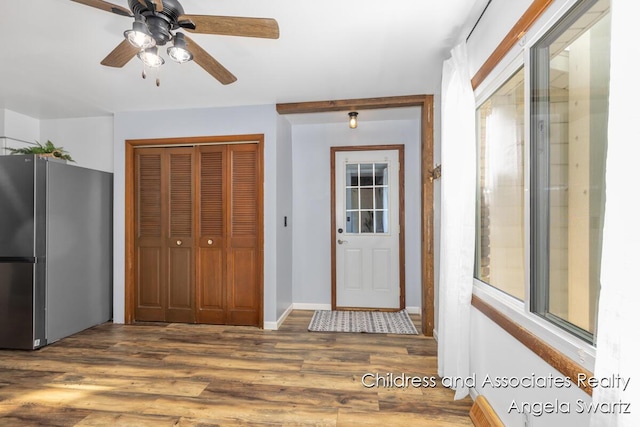 1328 S Montgomery St, Hastings, MI 49058 - foyer entrance featuring wood finished floors, ceiling fan, and baseboards