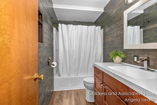 1328 S Montgomery St, Hastings, MI 49058 - full bath with vanity, toilet, wood finished floors, shower / tub combo, and wood walls