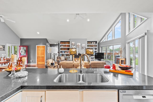 9228 Main St, Canadian Lakes, MI 49346 - kitchen featuring a sink, dishwasher, open floor plan, a ceiling fan, and high vaulted ceiling