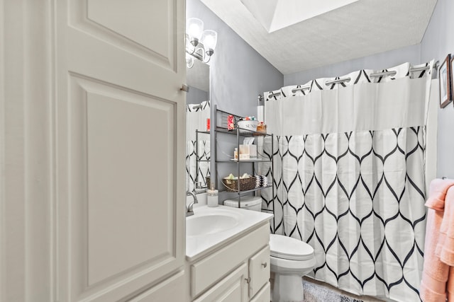 9228 Main St, Canadian Lakes, MI 49346 - bathroom featuring vanity, toilet, a textured ceiling, and a shower with curtain