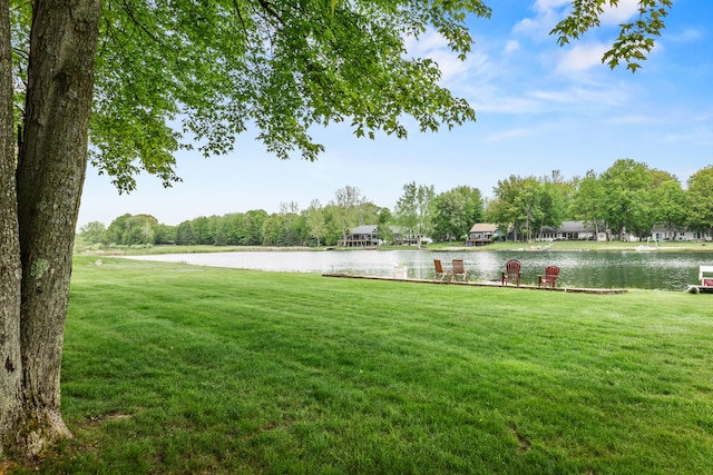 9228 Main St, Canadian Lakes, MI 49346 - view of green lawn featuring a water view