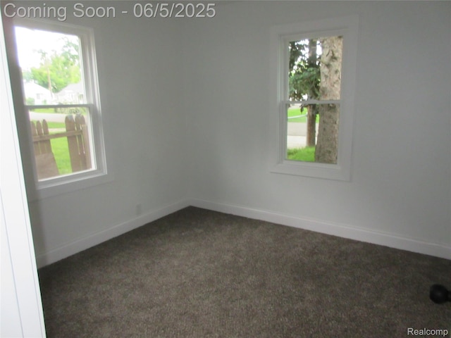 2220 E Bergin Ave, Burton, MI 48529 - unfurnished room featuring dark carpet and baseboards