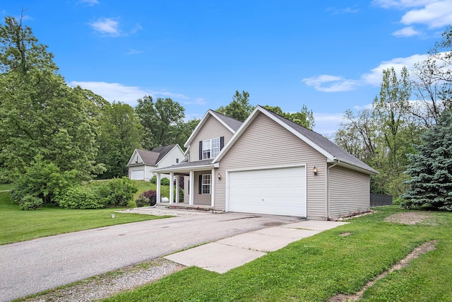 13860 Rolling Creek Dr, Lowell, MI 49331 - traditional home featuring a front yard, an attached garage, asphalt driveway, and a porch
