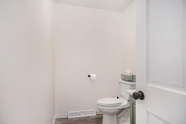 13860 Rolling Creek Dr, Lowell, MI 49331 - bathroom featuring wood finished floors, baseboards, and toilet