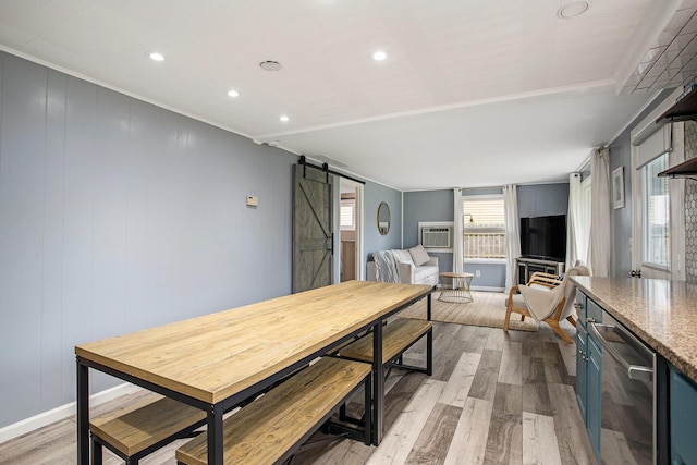12657 Blue Lagoon Rd, Shelbyville, MI 49344 - dining room featuring a barn door, wood finished floors, recessed lighting, baseboards, and a wall mounted AC