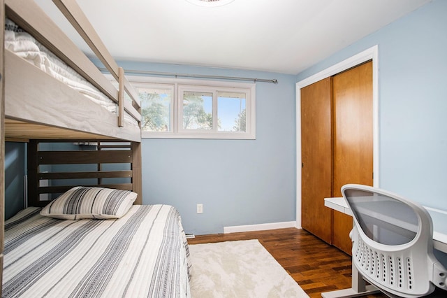12657 Blue Lagoon Rd, Shelbyville, MI 49344 - bedroom with a closet, wood finished floors, and baseboards