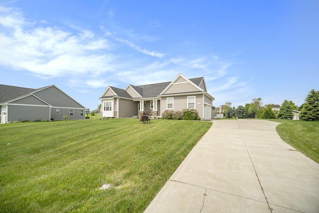 2842 Tall Grass Dr, Grass Lake, MI 49240 - view of front of house featuring a front lawn, concrete driveway, and a garage