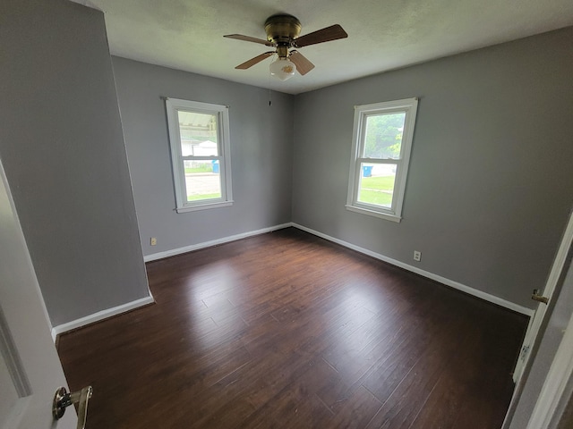 1607 Palmer Ave, Kalamazoo, MI 49001 - unfurnished room with a ceiling fan, baseboards, and dark wood finished floors
