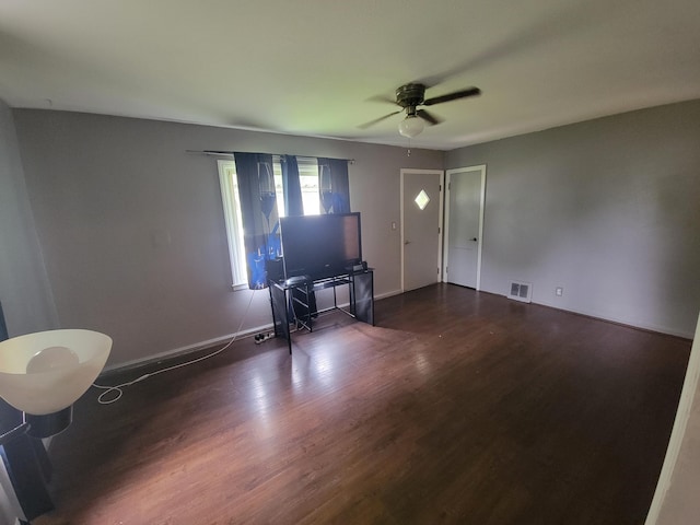 1607 Palmer Ave, Kalamazoo, MI 49001 - living room with ceiling fan, dark wood-type flooring, and baseboards