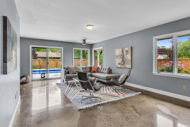 1102 S Durand St, Jackson, MI 49203 - living area featuring baseboards, ceiling fan, and french doors