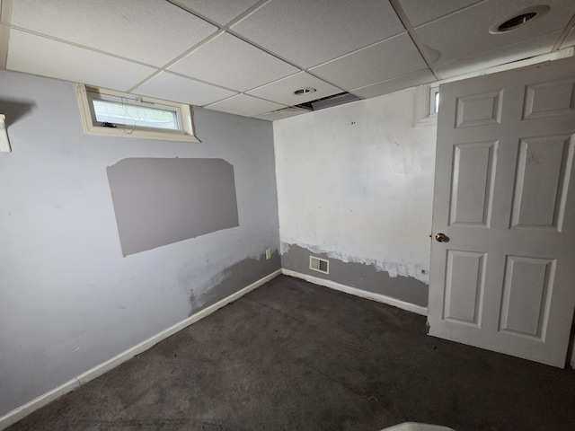 617 Stoll Rd, Lansing, MI 48917 - below grade area with carpet flooring, baseboards, and a drop ceiling