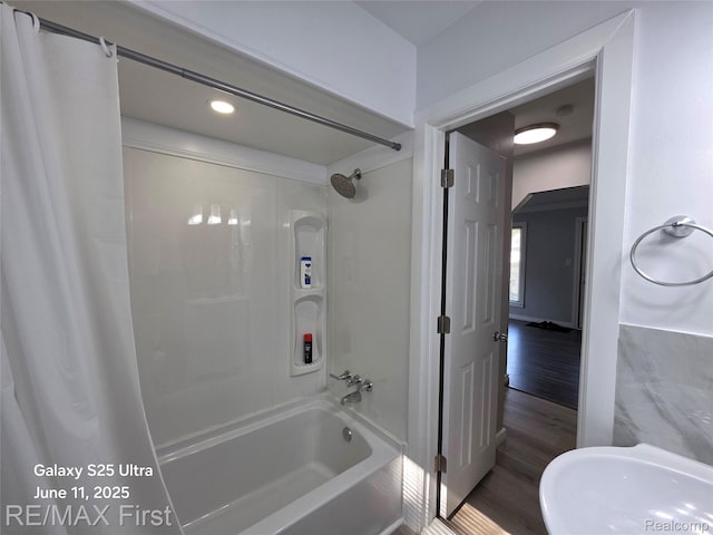 12725 Riverview St, Detroit, MI 48223 - bathroom featuring shower / bath combo with shower curtain, wood finished floors, and recessed lighting