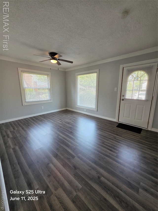 12725 Riverview St, Detroit, MI 48223 - unfurnished living room featuring ornamental molding, a textured ceiling, dark wood-type flooring, and a ceiling fan
