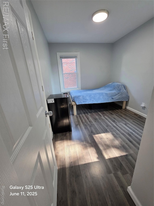 12725 Riverview St, Detroit, MI 48223 - bedroom featuring wood finished floors and baseboards