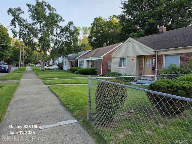 12725 Riverview St, Detroit, MI 48223 - view of front of property with brick siding, a chimney, and roof with shingles