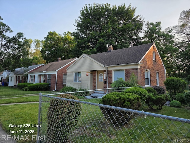 12725 Riverview St, Detroit, MI 48223 - view of front facade with brick siding, a chimney, and roof with shingles