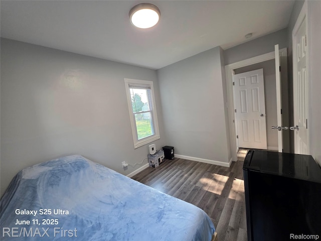 12725 Riverview St, Detroit, MI 48223 - bedroom featuring dark wood-type flooring and baseboards