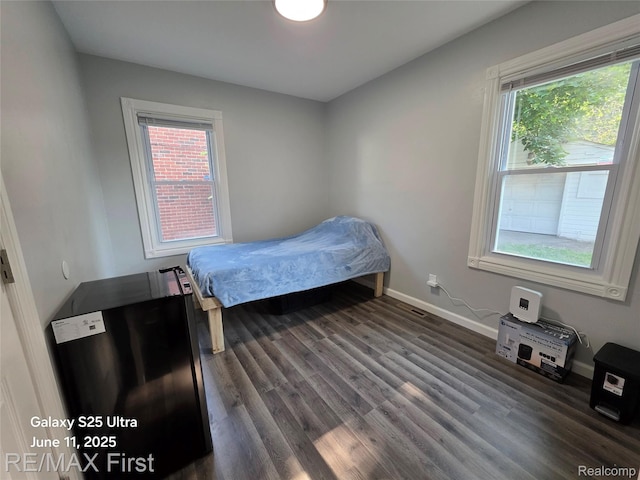 12725 Riverview St, Detroit, MI 48223 - bedroom featuring dark wood-style flooring and baseboards