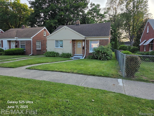 12725 Riverview St, Detroit, MI 48223 - bungalow-style home with brick siding, a chimney, and roof with shingles