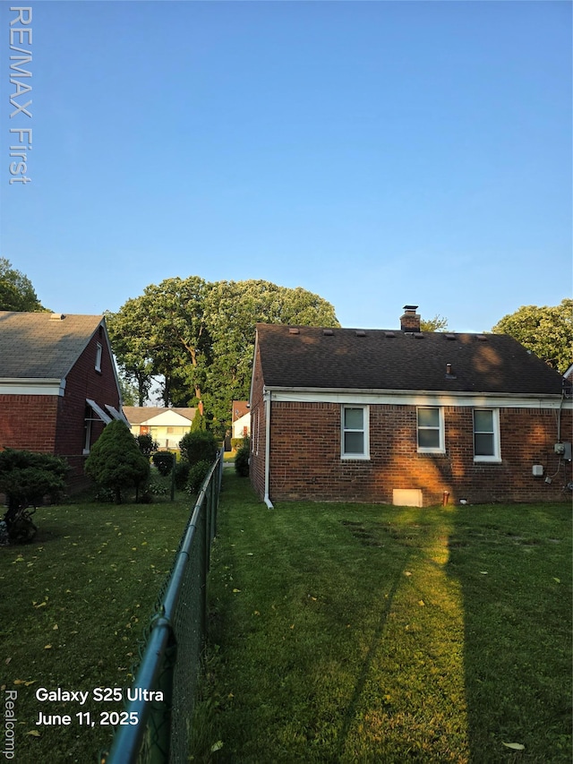 12725 Riverview St, Detroit, MI 48223 - view of property exterior featuring brick siding and a chimney